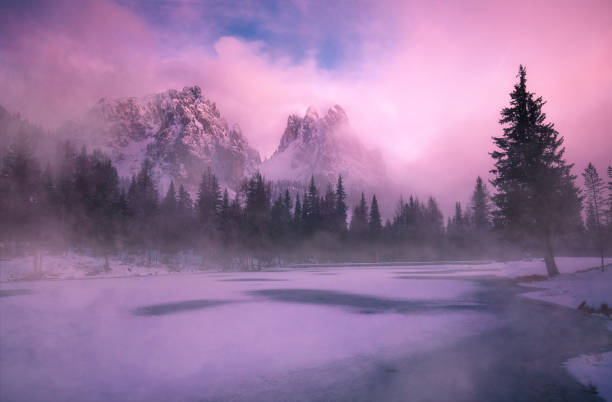 mystic sunset at lago antorno in the dolomites with fog and clouds - fog tree purple winter imagens e fotografias de stock