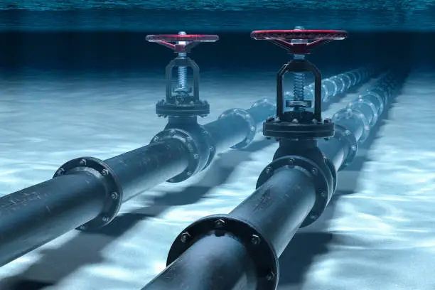 Photo of Pipeline lying on ocean bottom underwater. 3D rendering