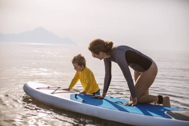 istock Mother and son on a paddle board 1094663400