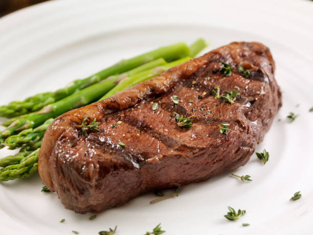 istock Medium Rare Top Sirloin Steak with Asparagus 1094663514