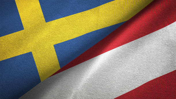istock Austria and Sweden two flags together textile cloth fabric texture 1094667998