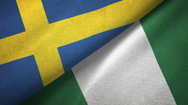 istock Nigeria and Sweden two flags together textile cloth fabric texture 1094668692