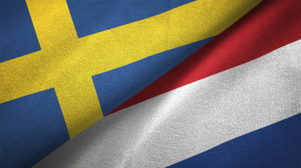 istock Netherlands and Sweden two flags together textile cloth fabric texture 1094668722