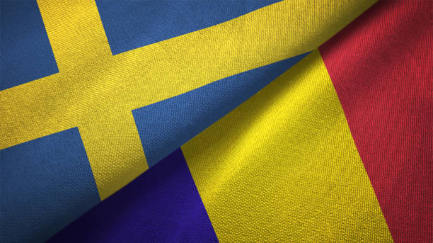 istock Romania and Sweden two flags together textile cloth fabric texture 1094668738