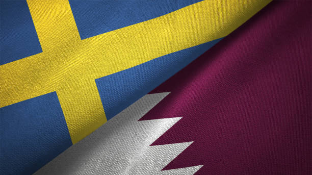 istock Qatar and Sweden two flags together textile cloth fabric texture 1094668754