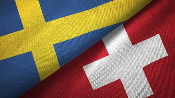 istock Switzerland and Sweden two flags together textile cloth fabric texture 1094668886