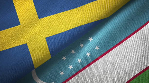 istock Uzbekistan and Sweden two flags together textile cloth fabric texture 1094668982
