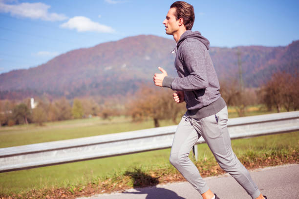 istock Young man jogging outdoors 1094669250