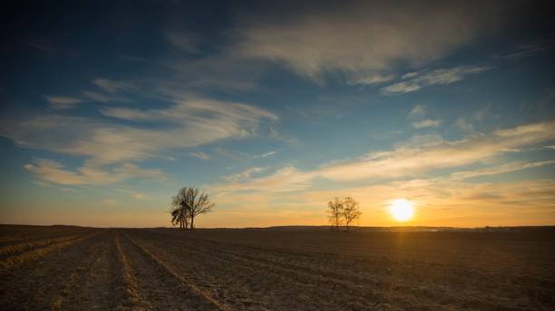 istock Beautiful evening colorful sky over plowed fields 1094672284