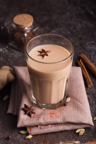istock Masala chai tea on the dark background. Hot indian beverage with spices 1094676346