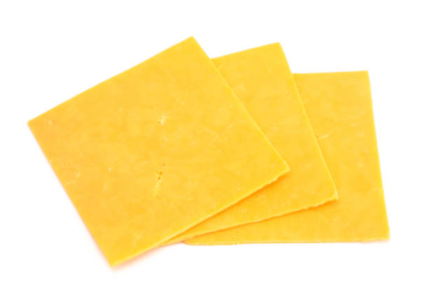 istock Slices of Cheddar Sandwich Cheese on a White Background 1094678642