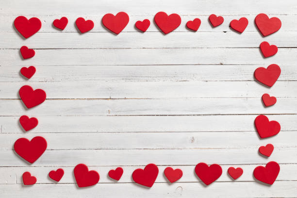 istock Red hearts on wooden white background. 1094679126