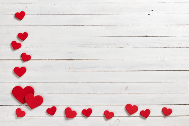 istock Red hearts on wooden white background. 1094679128