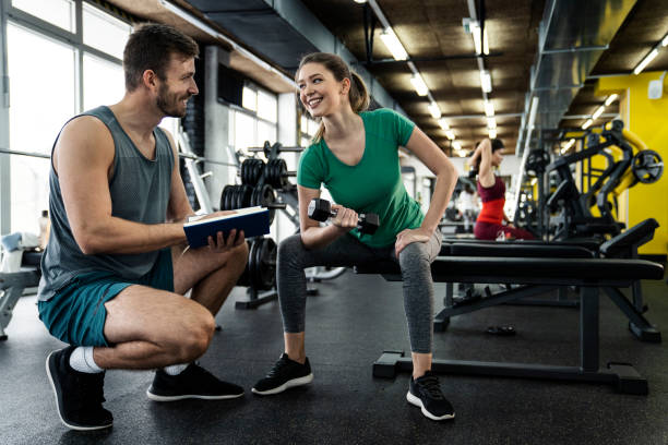 Active senior woman and fitness instructor The fitness instructor explains the current exercise plan What Can Fitness Trainers Do For You? stock pictures, royalty-free photos & images