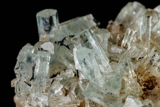 istock Macro mineral stone crystals Aquamarine in rock on a black background 1094681384