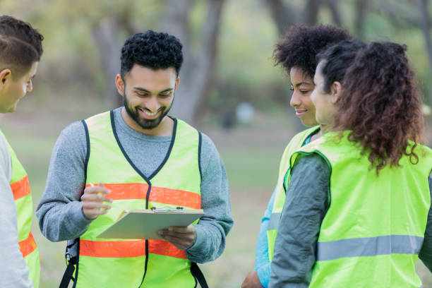 istock Male volunteer enjoys coordinating cleanup efforts 1094681462