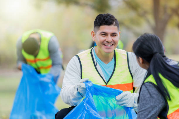 istock Male community cleanup volunteer shares progress 1094681484