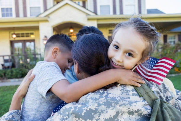 istock Children hug their military mom 1094681838