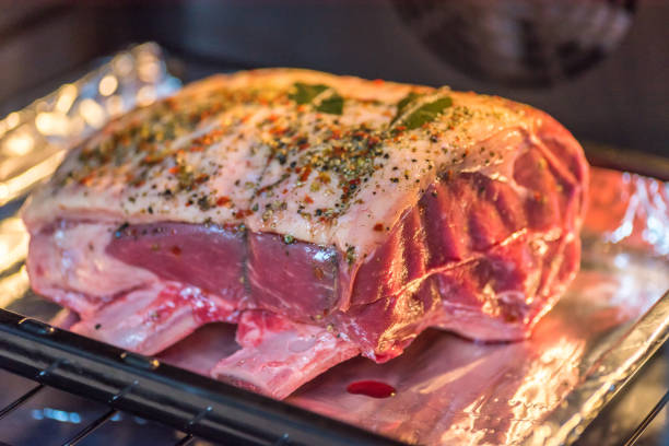istock closeup view raw beef cross rib chunk on oven tray with foil inside oven 1094684082