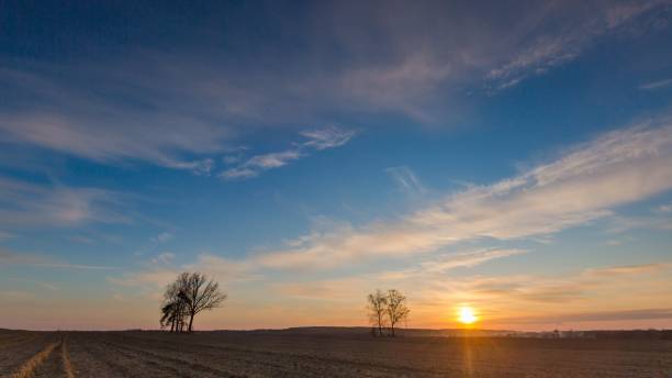 istock Beautiful evening colorful sky over plowed fields 1094684372