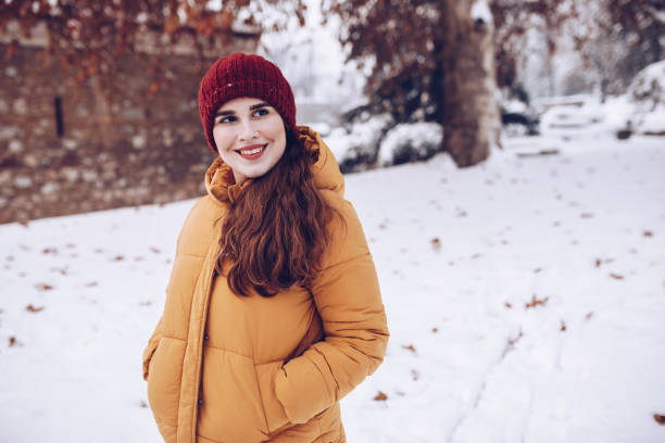 istock Young female posing on the winter snowy day 1094694972