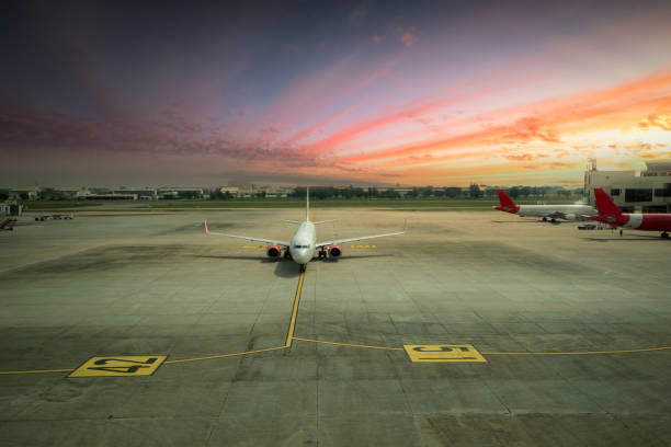 istock airplane ready for boarding in a airport hub at sunset 1094698194