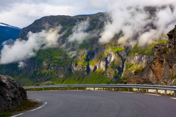 istock Mountain road among the low clouds. 1094707196
