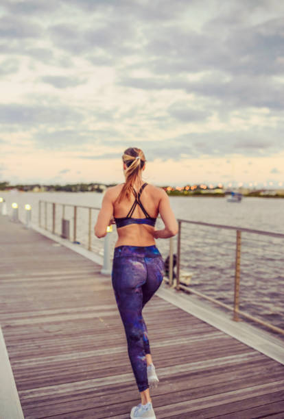 istock Runner, woman, on the waterfront exercising 1094708530