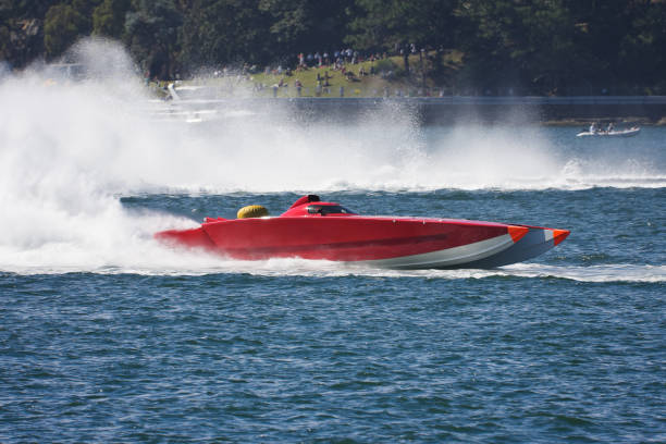 Powerboat Powerboat racing across the water racing boat photos stock pictures, royalty-free photos & images