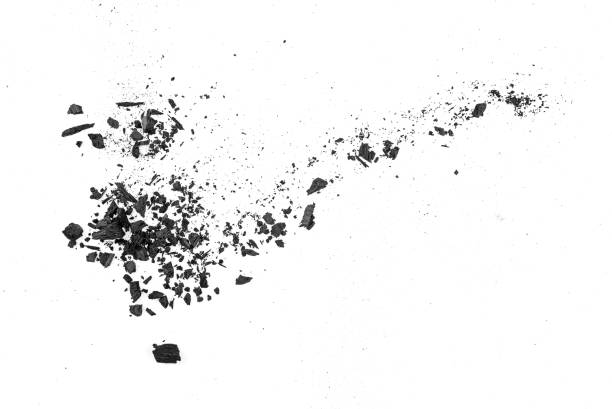 istock Small pieces of charcoal dust on white background, top view. 1094716794