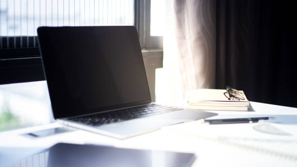 istock Desk Workplace with laptop  on white table ,Tools used for design ,notebook and tablet 1094723554