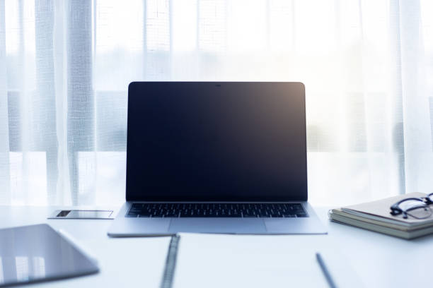 istock Desk Workplace with laptop  on white table ,Tools used for design ,notebook and tablet 1094724656