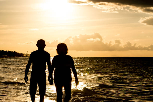istock Old couple relaxing by the beach. 1094730214
