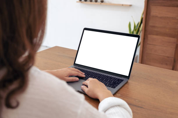 istock a woman using and typing on laptop with blank white desktop screen 1094730380