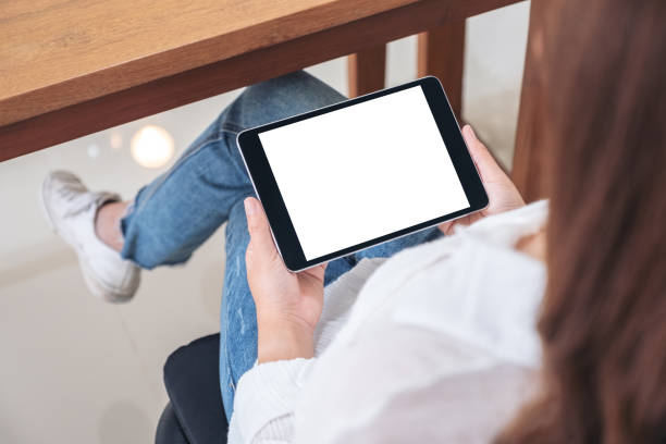 istock a woman holding black tablet pc with blank white screen horizontally 1094730394