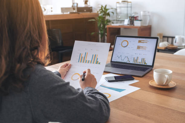 istock A businesswoman writing and working on business data and document 1094730482