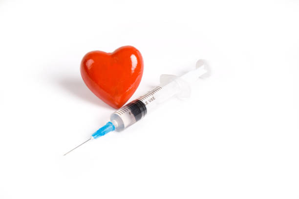 istock Syringe and Red Heart 1094730590