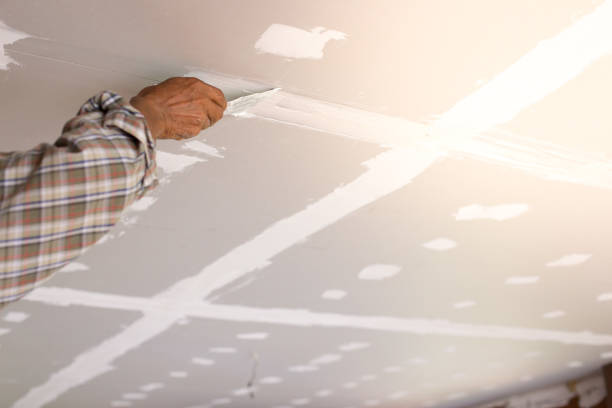 istock Hands of Workers are repairing the ceiling 1094732134