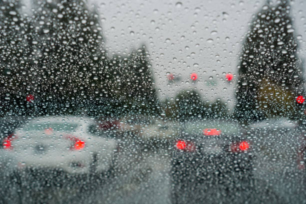 istock Raindrops on the windshield while driving on a rainy day during fall season 1094743458