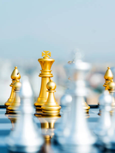 istock Golden and silver chess pieces are on the board 1094749332