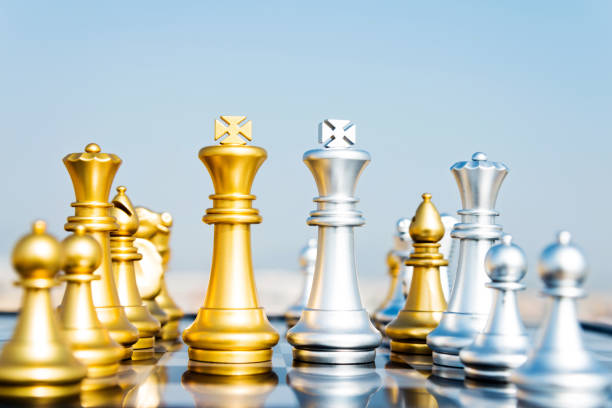istock Golden and silver chess pieces on the board 1094749488