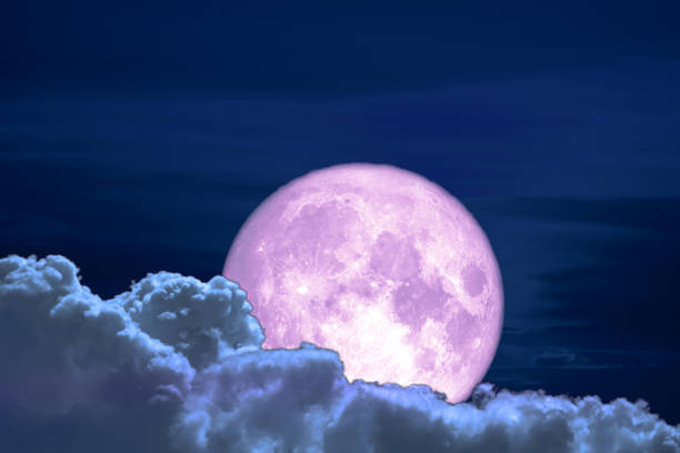 istock old moon back on silhouette colorful heap cloud on night sky 1094751262