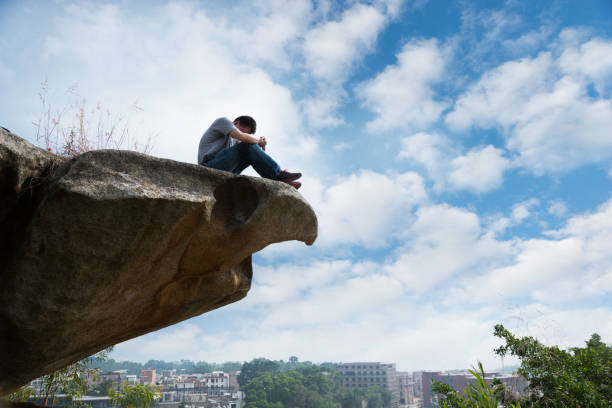 A blurred nature background with a sharp image of a rock in the foreground. Ready mockup.