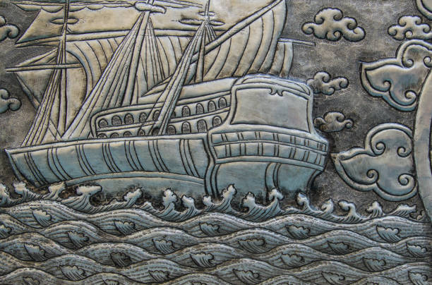 Bruges, Belgium - May 19, 2023: Relief of facade of brick wall of Boniface Bridge by Dijver Canal