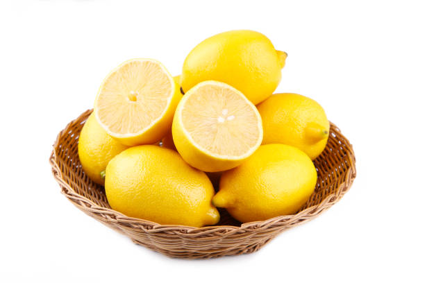 istock Lemon in basket isolated on white background. Tropical fruit. 1094758988