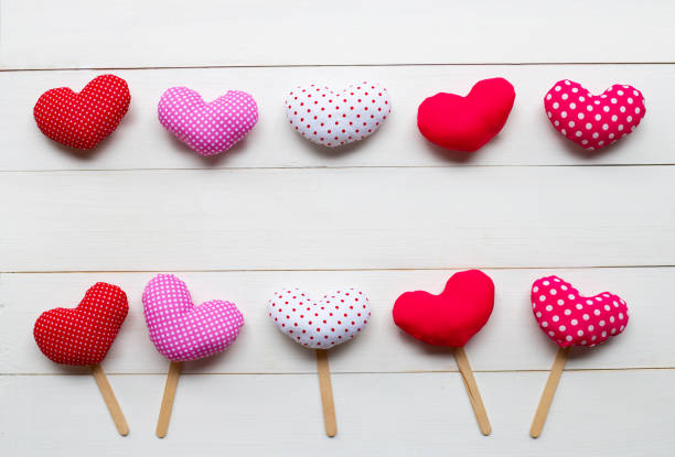 istock Valentine's hearts on white wooden background. 1094760602