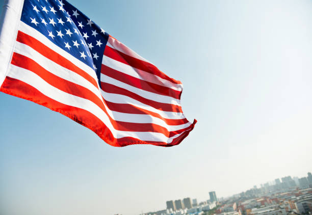 istock Waving American flag and building 1094760722