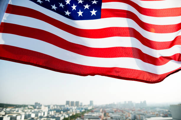 istock Waving American flag and building 1094760808
