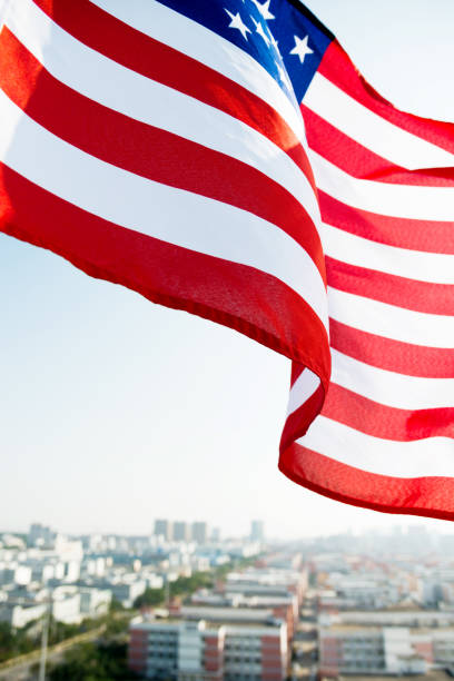 istock Waving American flag and building 1094760820