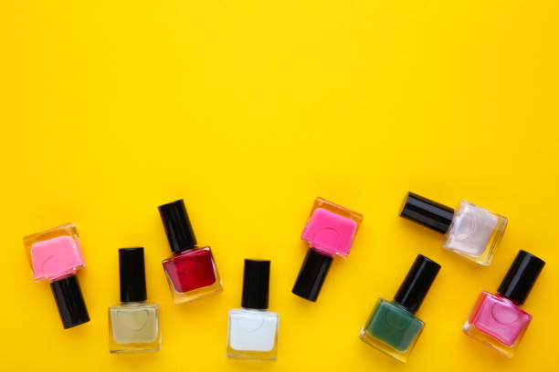 istock Group of bright nail polishes on yellow 1094761682